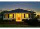 Charming single-story home with a welcoming front porch and well-maintained landscaping at 2227 Bonn Ct, Punta Gorda, FL 33983