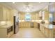 Bright kitchen showcases stainless steel appliances, granite counters, and tile floors at 2227 Bonn Ct, Punta Gorda, FL 33983
