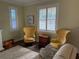 Living room featuring two yellow armchairs and a couch at 2227 Bonn Ct, Punta Gorda, FL 33983