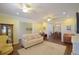 Inviting living room with neutral sofa, and an open floorplan to the dining room at 2227 Bonn Ct, Punta Gorda, FL 33983