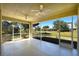 Covered porch with concrete floors and large screened windows overlooking backyard at 2227 Bonn Ct, Punta Gorda, FL 33983