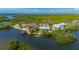 Waterfront property featuring a boat dock, lush greenery, and a serene view of the surrounding waterways at 24139 Jolly Roger Blvd, Punta Gorda, FL 33955