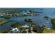 Waterfront home showcasing the community's stunning bay view surrounded by lush landscaping at 24139 Jolly Roger Blvd, Punta Gorda, FL 33955