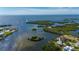 Stunning aerial view of a waterfront property with access to the open ocean and several private islands at 24139 Jolly Roger Blvd, Punta Gorda, FL 33955