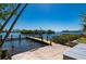 Private boat dock overlooking the canal on a sunny day, perfect for waterfront living at 24139 Jolly Roger Blvd, Punta Gorda, FL 33955