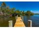 Private wooden dock with room to enjoy the water and surrounding nature at 24139 Jolly Roger Blvd, Punta Gorda, FL 33955