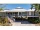 Beautiful raised beach home with a metal roof, expansive deck, and covered parking at 24139 Jolly Roger Blvd, Punta Gorda, FL 33955