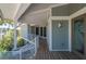 Charming front porch leading to the entrance, offering scenic views and privacy at 24139 Jolly Roger Blvd, Punta Gorda, FL 33955