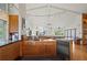 Bright and spacious kitchen with a modern island cooktop, plenty of storage, and modern lighting at 24139 Jolly Roger Blvd, Punta Gorda, FL 33955