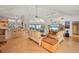 Bright living room with hardwood floors, modern furnishings, and expansive waterfront views at 24139 Jolly Roger Blvd, Punta Gorda, FL 33955