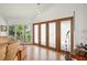 Bright living room featuring large glass paneled doors, and scenic views at 24139 Jolly Roger Blvd, Punta Gorda, FL 33955