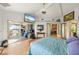 Bright bedroom features hardwood floors, deck access, and stylish decor at 24139 Jolly Roger Blvd, Punta Gorda, FL 33955