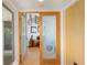 Entry way and open view of a bright main bedroom featuring hardwood floors and unique decorations at 24139 Jolly Roger Blvd, Punta Gorda, FL 33955