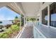 Covered patio with a built in kitchen and waterfront views at 24139 Jolly Roger Blvd, Punta Gorda, FL 33955