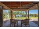 View under the home with patio seating, a spiral staircase, and beautiful waterfront views at 24139 Jolly Roger Blvd, Punta Gorda, FL 33955