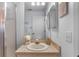 Bathroom featuring a vanity with a sink and a wall mirror at 25100 Sandhill Blvd # R202, Punta Gorda, FL 33983