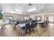 Clubhouse dining room setup with tables and chairs next to pool at 25100 Sandhill Blvd # R202, Punta Gorda, FL 33983