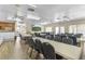 Clubhouse dining room setup with tables and chairs with kitchenette at 25100 Sandhill Blvd # R202, Punta Gorda, FL 33983