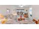 Inviting living room with comfortable seating, large sliding glass doors to the lanai, and a bright, airy feel at 25100 Sandhill Blvd # R202, Punta Gorda, FL 33983