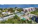 An aerial view highlighting the property's location near tennis courts, a community pool and ocean access at 25188 Marion Ave # A206, Punta Gorda, FL 33950