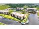An aerial view of beautiful waterfront condos, lush greenery, and boat docks at 25188 Marion Ave # A206, Punta Gorda, FL 33950