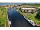 Aerial view of waterfront condos and boat docks, accentuating the relaxed coastal living experience at 25188 Marion Ave # A206, Punta Gorda, FL 33950