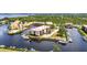 Aerial view of condo complex featuring boat docks, waterfront access, and convenient parking at 25188 Marion Ave # A206, Punta Gorda, FL 33950