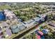 Aerial view of tennis courts, boat slips, and a canal running through the community at 25188 Marion Ave # A206, Punta Gorda, FL 33950