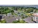 Overhead view showcasing tennis courts, parking, landscaping, and building exteriors within the community at 25188 Marion Ave # A206, Punta Gorda, FL 33950