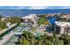 A beautiful aerial shot of the property's tennis courts, pool, and surrounding waterfront condos at 25188 Marion Ave # A206, Punta Gorda, FL 33950