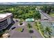 Aerial view of community pool and tennis courts showcasing the complex and amenities at 25188 Marion Ave # A206, Punta Gorda, FL 33950