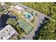Aerial image of a tennis court, swimming pool, boat docks and water canal at 25188 Marion Ave # A206, Punta Gorda, FL 33950