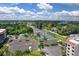 Aerial view featuring tennis courts, parking, and lush greenery, enhancing the active lifestyle appeal of this community at 25188 Marion Ave # A206, Punta Gorda, FL 33950