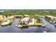 Aerial view of condo complex with boat docks, waterfront access, and beautiful landscaping at 25188 Marion Ave # A206, Punta Gorda, FL 33950