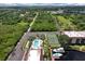 Overhead view of community featuring pool, tennis court, boat docks, and lush greenery, enhancing the appeal for active residents at 25188 Marion Ave # A206, Punta Gorda, FL 33950