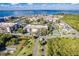 Wide aerial view of a waterfront community featuring tennis courts, a pool, and boat docks at 25188 Marion Ave # A206, Punta Gorda, FL 33950