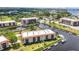 Stunning aerial view of waterfront condos with boat docks and lush landscaping at 25188 Marion Ave # A206, Punta Gorda, FL 33950