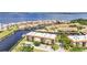 Aerial view shows condos and townhomes along canals, each with dock access at 25188 Marion Ave # A206, Punta Gorda, FL 33950