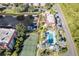 Aerial shot featuring tennis court, swimming pool, boat docks and water canal at 25188 Marion Ave # A206, Punta Gorda, FL 33950