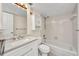 Well-lit bathroom with vanity, toilet, and shower-tub combo at 25188 Marion Ave # A206, Punta Gorda, FL 33950