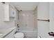 Neutral toned bathroom featuring tub/shower, and white storage cabinet at 25188 Marion Ave # A206, Punta Gorda, FL 33950