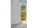 Bedroom with window overlooking trees at 25188 Marion Ave # A206, Punta Gorda, FL 33950
