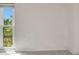Bedroom with window overlooking trees at 25188 Marion Ave # A206, Punta Gorda, FL 33950