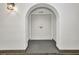 Condo entrance door with an arched entry and an overhead light at 25188 Marion Ave # A206, Punta Gorda, FL 33950