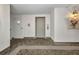 Hallway with an elevator and neutral colored walls and carpeted floor at 25188 Marion Ave # A206, Punta Gorda, FL 33950