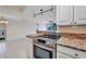 Open kitchen and living room at 25188 Marion Ave # A206, Punta Gorda, FL 33950