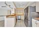 Kitchen featuring modern appliances, cabinetry and breakfast bar at 25188 Marion Ave # A206, Punta Gorda, FL 33950