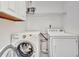 Laundry room with washer, dryer and storage at 25188 Marion Ave # A206, Punta Gorda, FL 33950