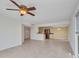 Bright, open floor plan with tile flooring and modern ceiling fan fixture at 25188 Marion Ave # A206, Punta Gorda, FL 33950