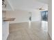 Open concept living space with ceramic tile floors and a view of the harbor at 25188 Marion Ave # A206, Punta Gorda, FL 33950